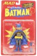 This is the first in DC DIRECT's line of JUST-US-LEAGUE OF STUPID HEROES action figures that feature MAD MAGAZINE's resident idiot Alfred E. Neuman as classic DC Comics super-heroes. Standing 5.75 tall with multiple points of articulation, ALFRED E. NEUMAN AS BATMAN features two sets of hands, a removable utility belt with removable Bat/Banana-rang, yo-yo and an extra long cloth cape. Packaged in a 4-color blister.